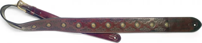 Dark brown padded distressed leatherette guitar strap with pressed flower pattern